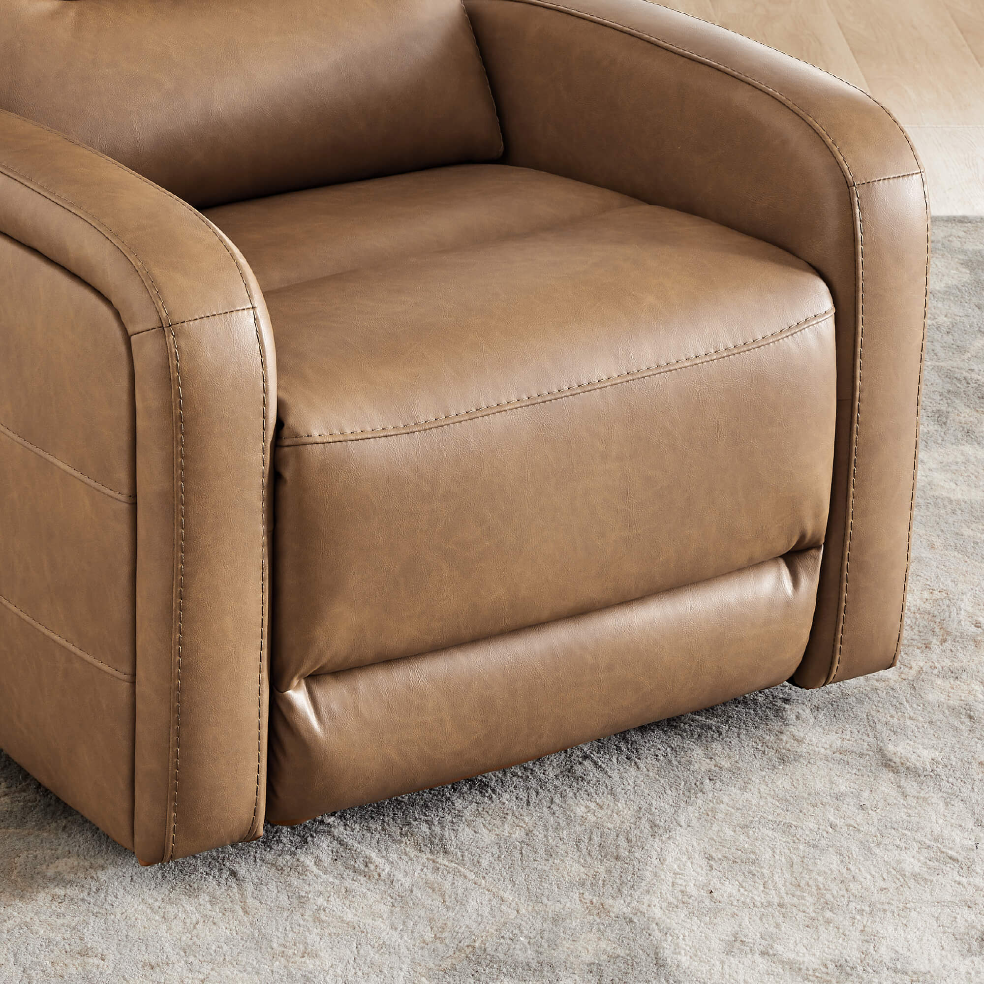 Warm brown Theo Power Swivel Glider Recliner close-up with plush cushion and sleek arms - CHITA Living