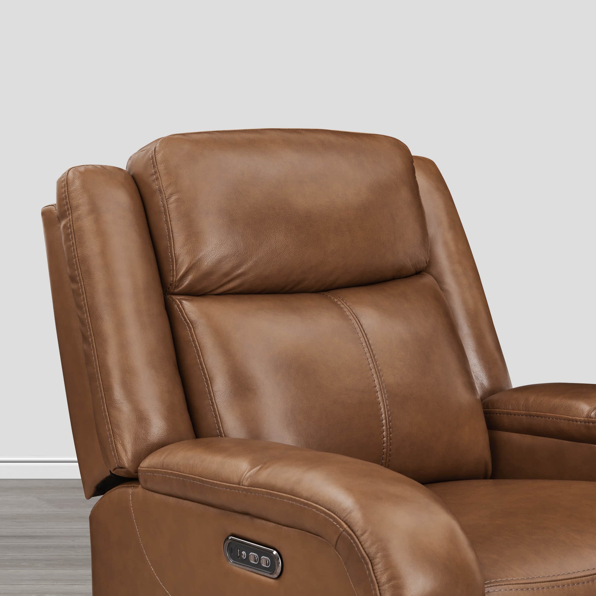 Close-up of Isaac Wall Hugger Recliner in warm brown leather with power controls - CHITA Living