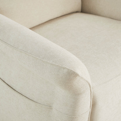 Detail of cream power recliner's armrest showing quality upholstery stitching.