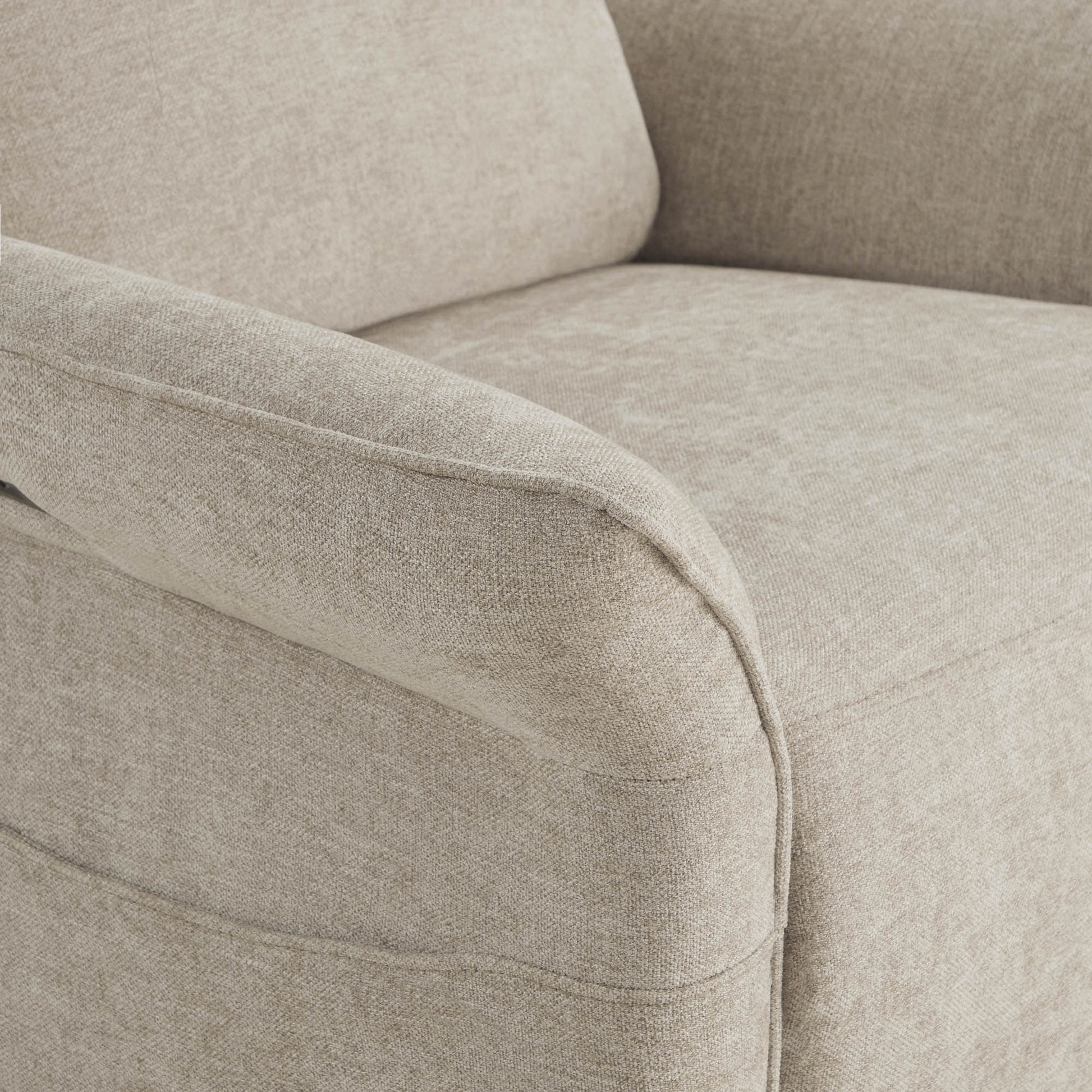 Close-up detail of power recliner's armrest showing quality fabric texture.