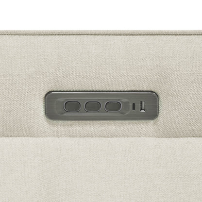 Close-up of power recliner control panel with multiple adjustment buttons.