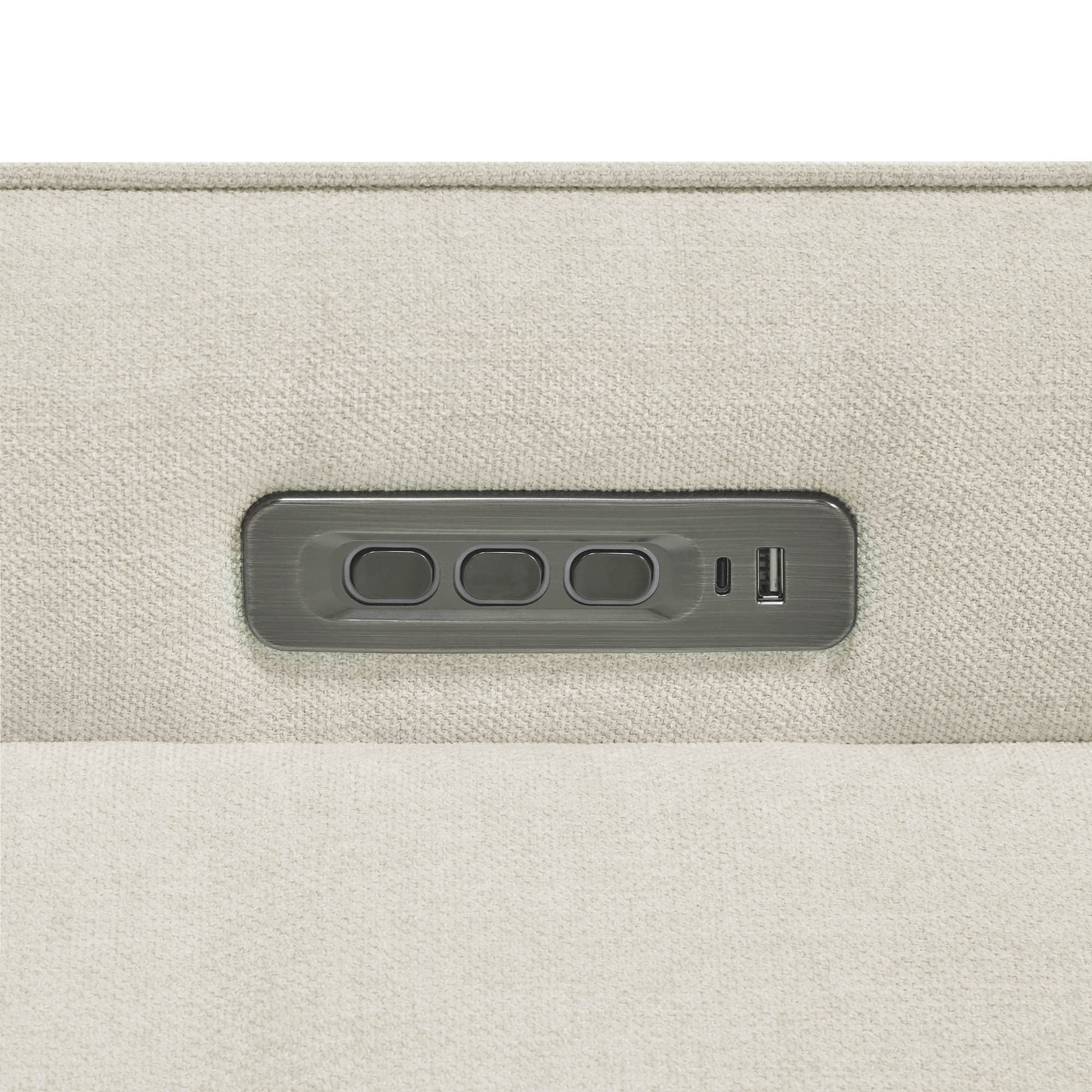 Close-up of power recliner control panel with multiple adjustment buttons.