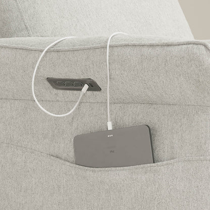 Gray power recliner footrest control panel cleverly integrated into armrest design.