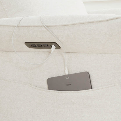 Gray power recliner footrest detail showing textured upholstery and padding.