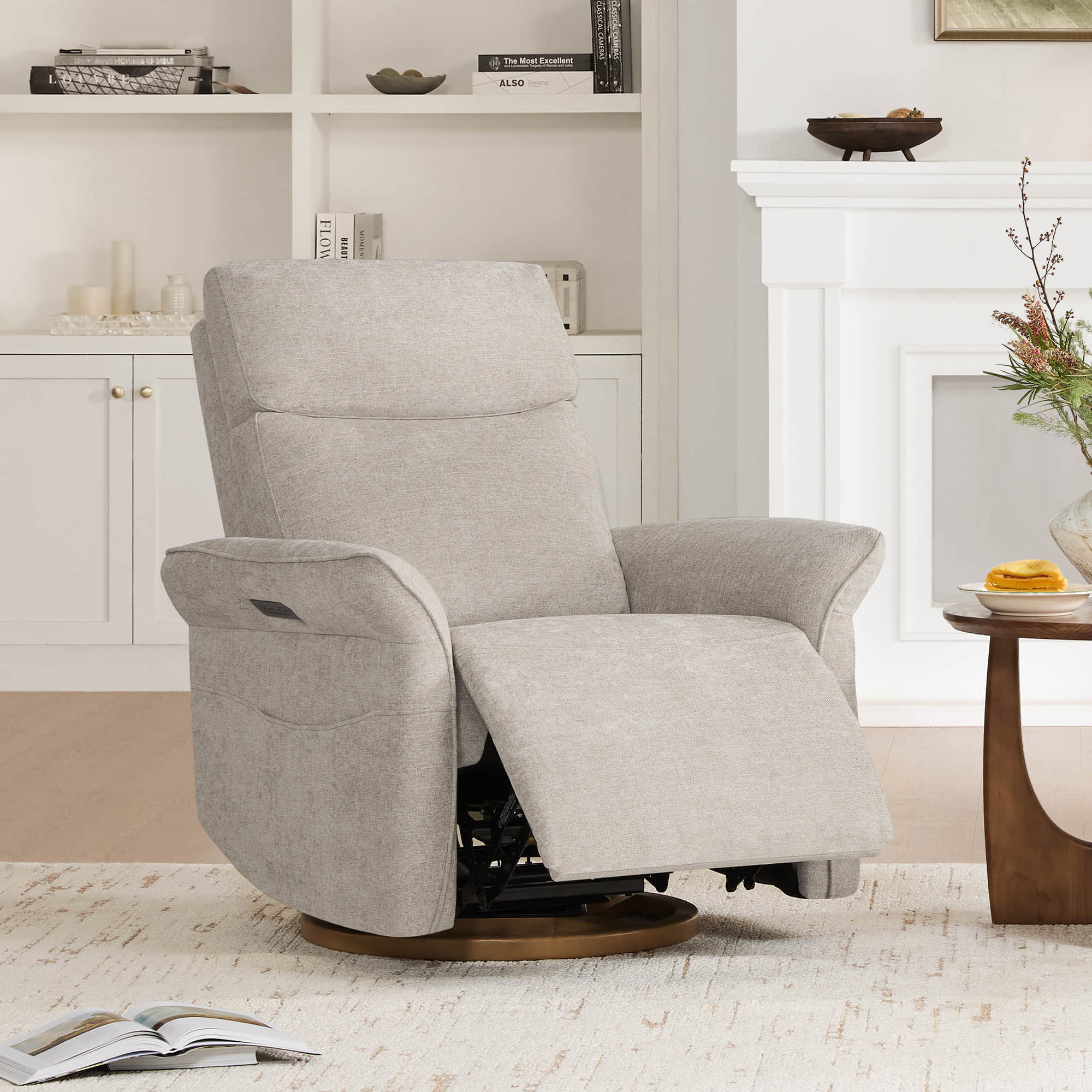 Matching cream swivel recliners with extended footrests in contemporary living space.