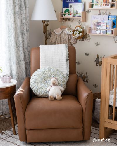 A cozy nursery corner with a brown leather recliner
