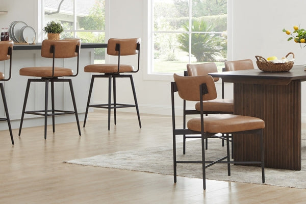 A modern dining area with brown leather chairs, a wooden table, and large windows.