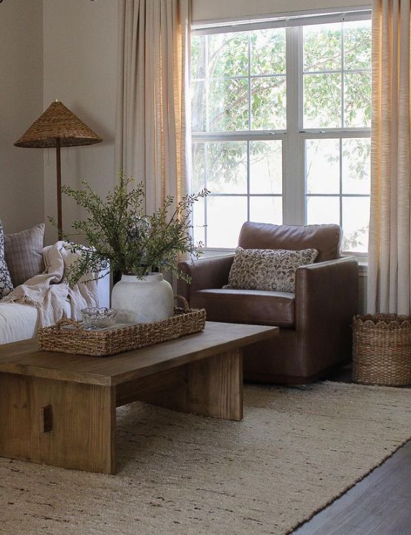 A cozy living room with a brown leather armchair