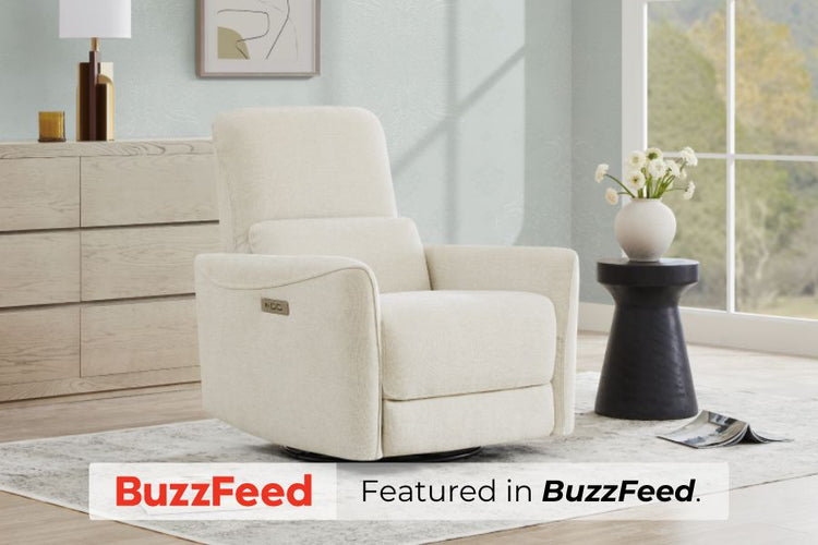 A cream-colored recliner in a modern living room with a side table and vase, featured in BuzzFeed.