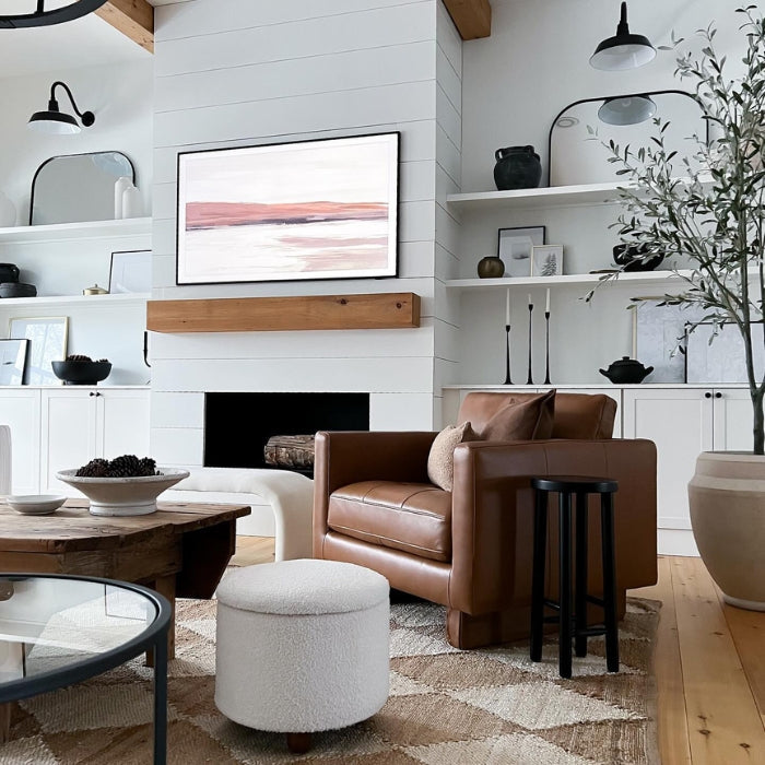 A cozy living room with a brown leather armchair