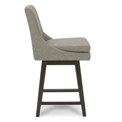 Side view of Lissa Swivel Bar Stool with soft grey leather seat and dark wood legs - CHITA Living