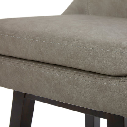 Close-up of Lissa Swivel Bar Stool with soft grey leather seat and solid wood legs - CHITA Living