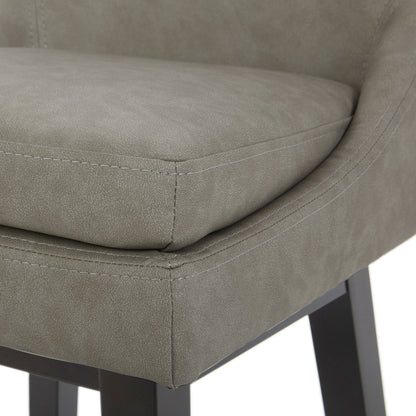Close-up of Lissa Swivel Bar Stool featuring soft grey leather seat and durable black legs - CHITA Living