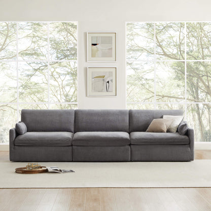 Kenna 3 Seat Modular Sofa in gray fabric, deep seating and modern design for living room with natural light and lush greenery