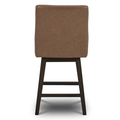Back view of Lissa Swivel Bar Stool with brown leather seat and sturdy wooden legs - CHITA Living