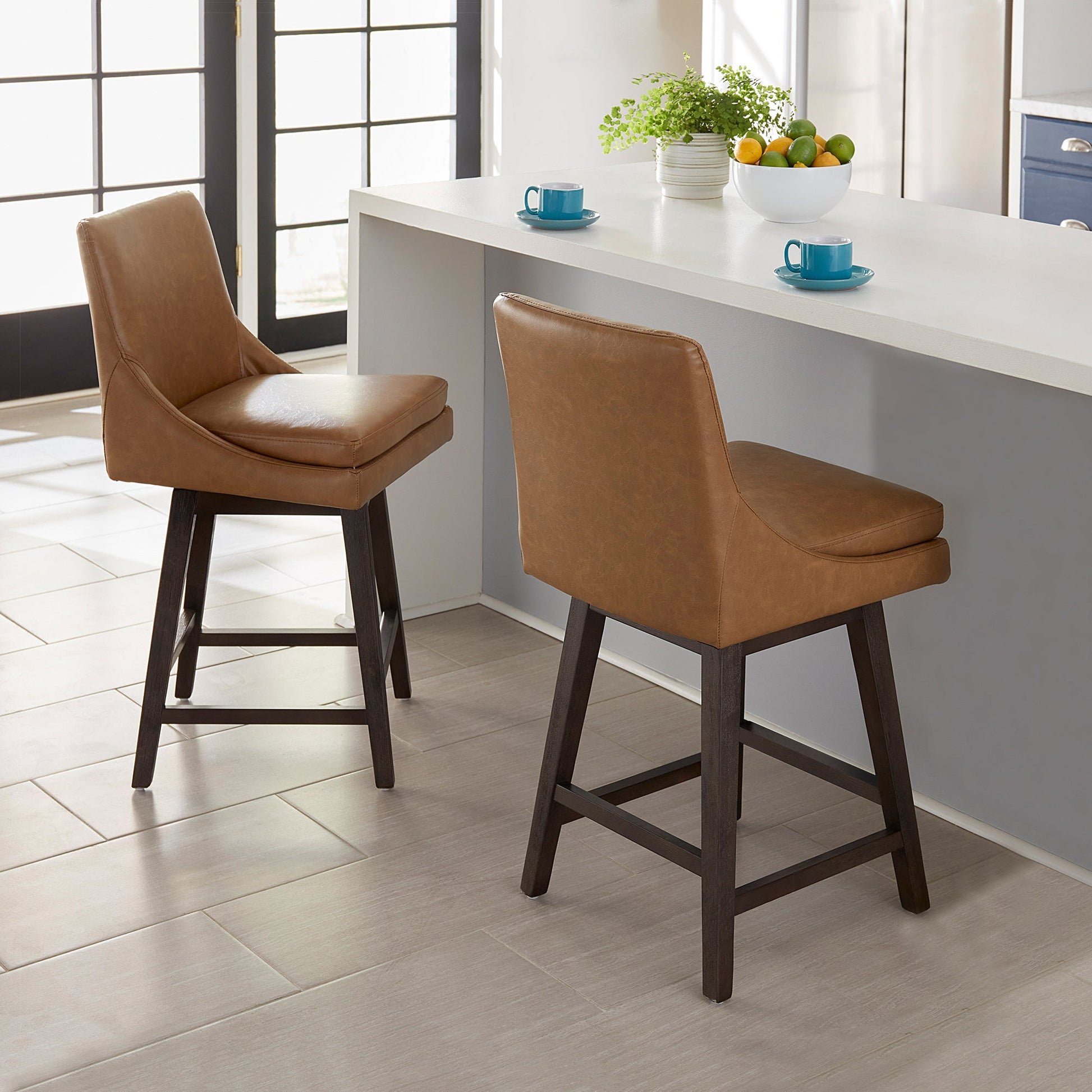 Lissa Swivel Bar & Counter Stool with brown leather seat at a modern kitchen counter - CHITA Living